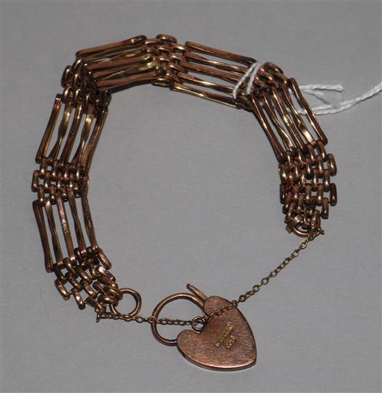 A 9ct gold gatelink bracelet with heart shaped padlock clasp, 12.8 grams.
